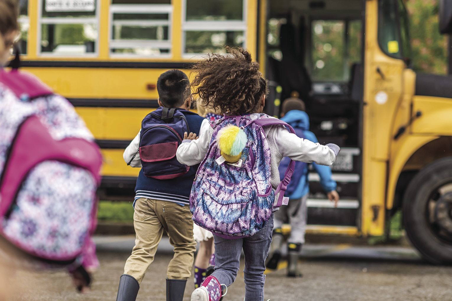 Kids running to the bus